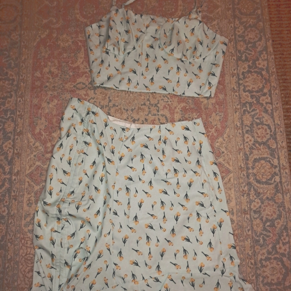 A light blue 2 piece tank and high waisted skirt